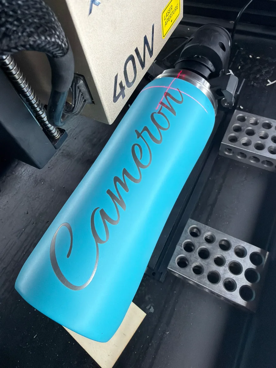 Name engraving on a powder-coated bottle using the rotary attachment
